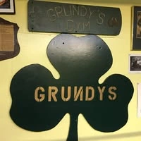 The hand-painted Grundy's shamrock sign hanging inside the gym